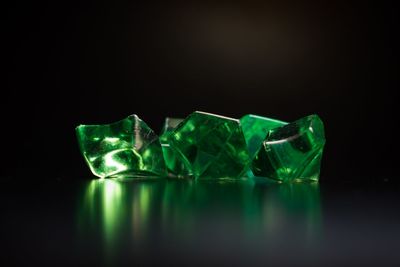 Close-up of green crystals on black background