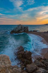 Scenic view of sea against sky during sunset