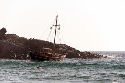 A boat in the waves in the island of patmos, greece