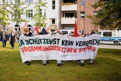 Group of people in front of building