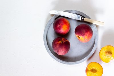 High angle view of fruits in plate on table
