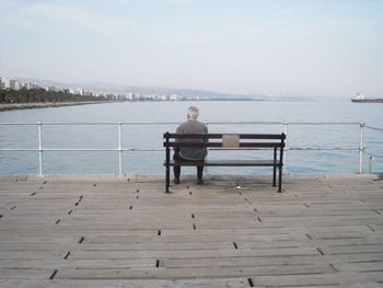 Man standing on pier