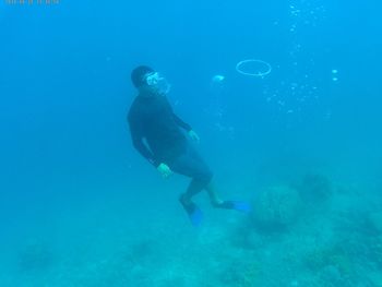 Full length of man snorkeling in sea