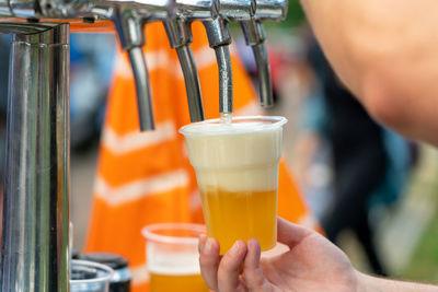 Cropped image of man holding drink