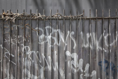 Full frame shot of wooden fence against wall