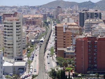 High angle view of street amidst buildings in city