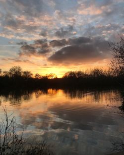 Reflection of clouds in lake during sunset