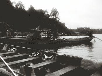 Boat sailing in river against sky