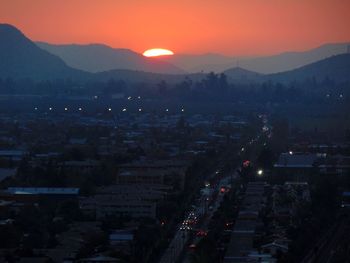 High angle view of cityscape against sky during sunset