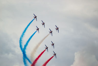 Low angle view of airshow in sky