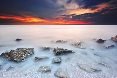 Scenic view of sea against sky during sunset
