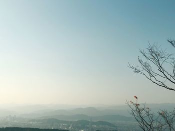 Scenic view of mountains against clear sky at sunset