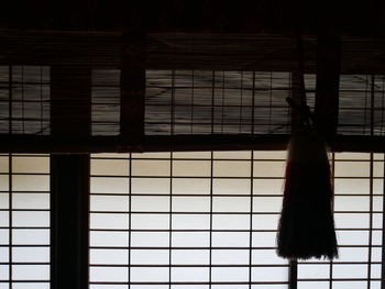 Rear view of woman walking on window
