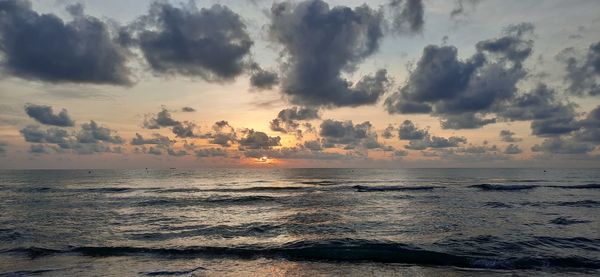 Scenic view of sea against sky during sunset