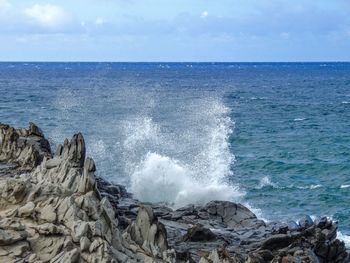 Coastline rugged lava  dragons teeth and crashing waves makaluapuna point near kapalua, maui hi usa