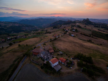 High angle view of houses against sky during sunset