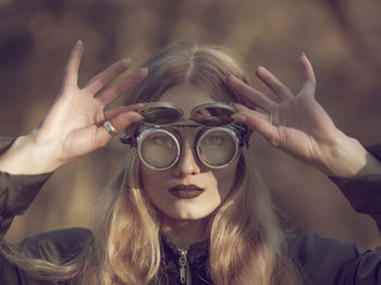 Close-up of young woman wearing sunglasses