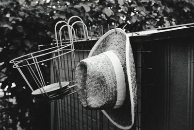 Close-up of hat on wicker basket