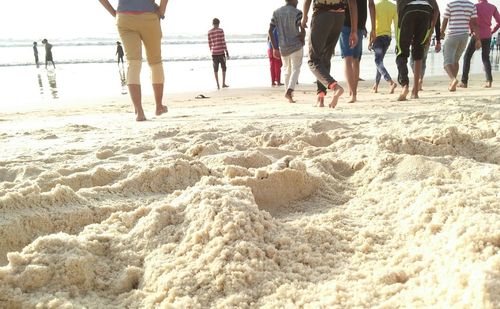 Low section of people on beach