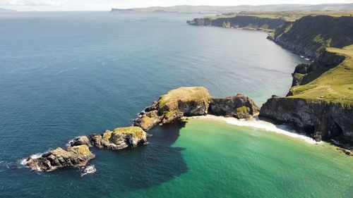 High angle view of rocks at sea shore