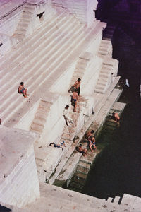 High angle view of people walking on building