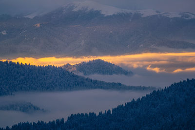 Scenic view of mountains against sky during sunset