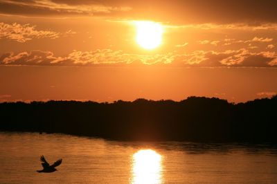 Scenic view of lake at sunset