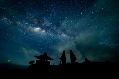 Low angle view of stars glowing in sky