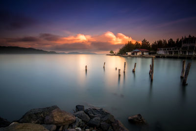 Scenic view of lake against sky during sunset