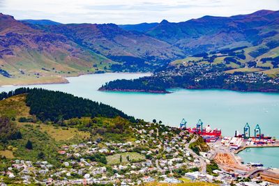 High angle view of lake and mountains against sky