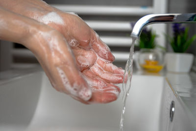 Midsection of man in bathroom at home