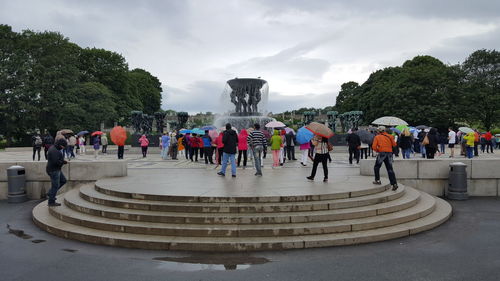 People at town square against sky