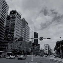 View of city street and buildings against sky
