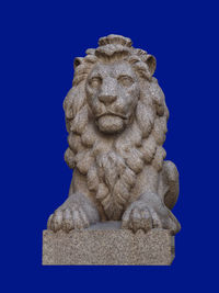 Close-up of statue against blue background