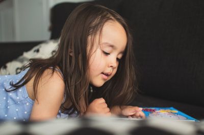 Portrait of girl looking at camera at home