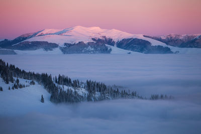 Scenic view of mountains against sky during winter