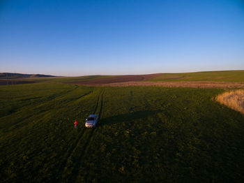 Scenic view of agricultural field against clear sky