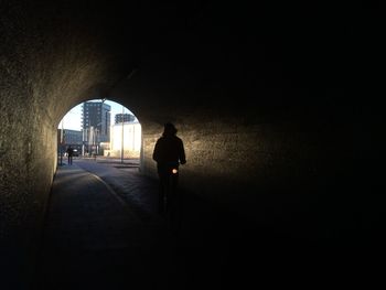 Full length of woman walking on footbridge