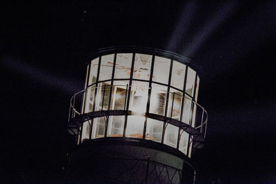 Low angle view of water tower against sky at night