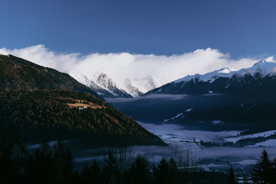 Scenic view of snowcapped mountains against sky