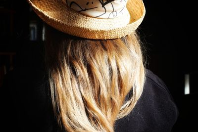 Rear view of woman in hat