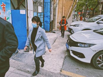 People standing on street in city