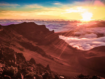 Scenic view of mountains against sky during sunset