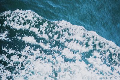 High angle view of water flowing in sea