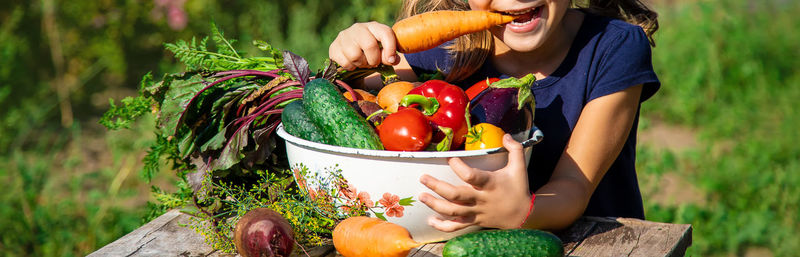 Midsection of woman holding food