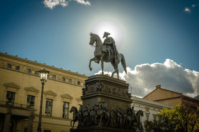 Low angle view of statue against sky