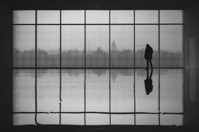 Man standing by window