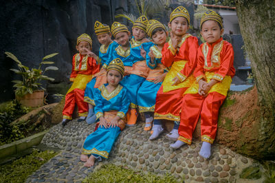 Kindergarten is conducting graduation, some of the groups are wearing traditional indonesian dance.