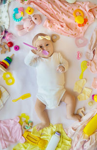 High angle view of cute girl playing with toys