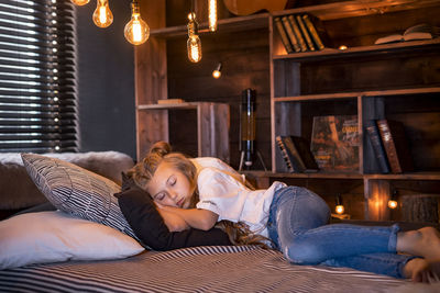 Woman lying on bed